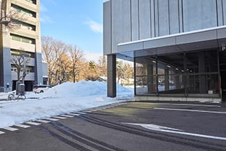Photo of a parking lot outside of a business with snow